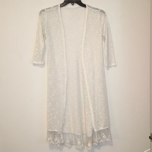 Francesca’s open knit duster with lace-trimmed hem